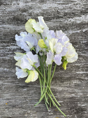 Load image into Gallery viewer, Bouquet of white and light purple flowers on a wooden surface